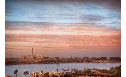 Carlsbad Power Plant at sunrise with clouds