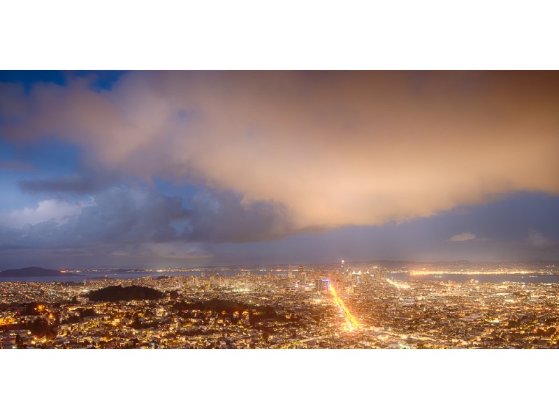 San Francisco Market Street by night with lit up clouds