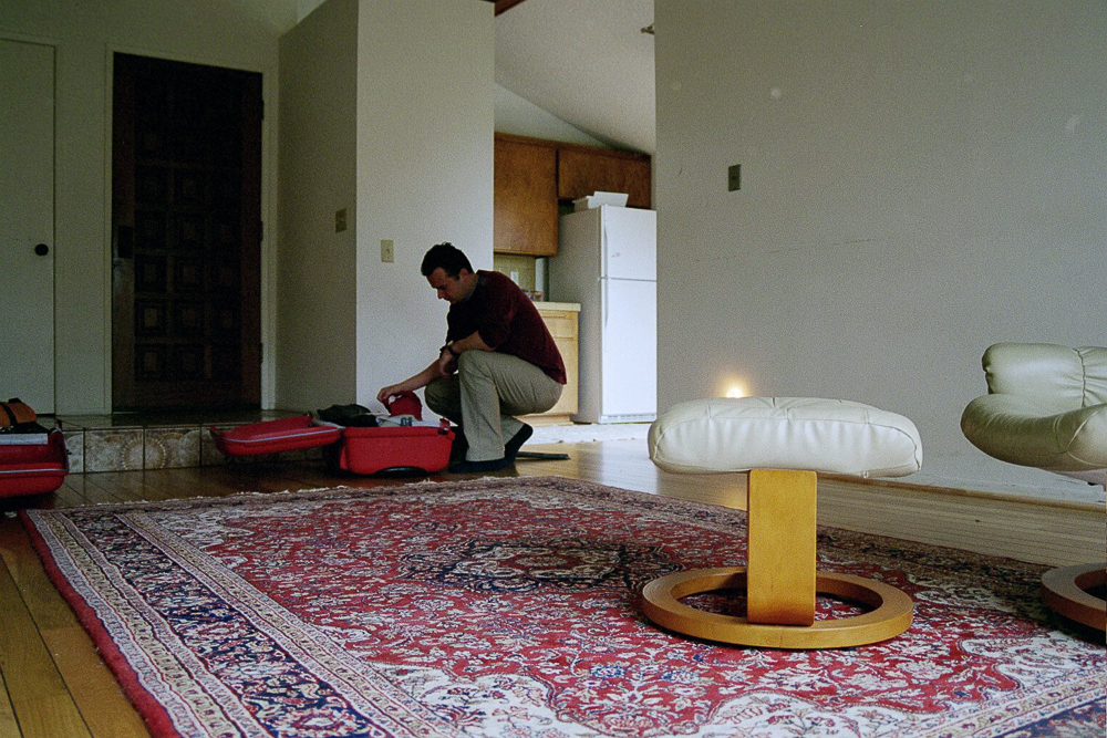 Roy Kerckhoffs unpacking his suitcase in his apartment after arriving in San Diego.