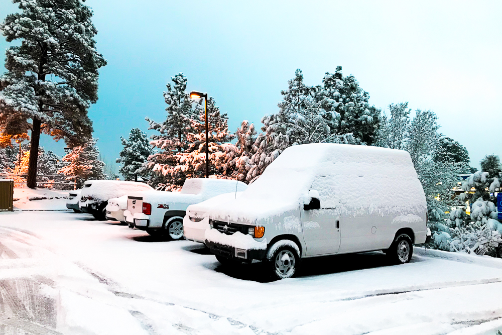 flagstaff arizona cargo van covered in snow