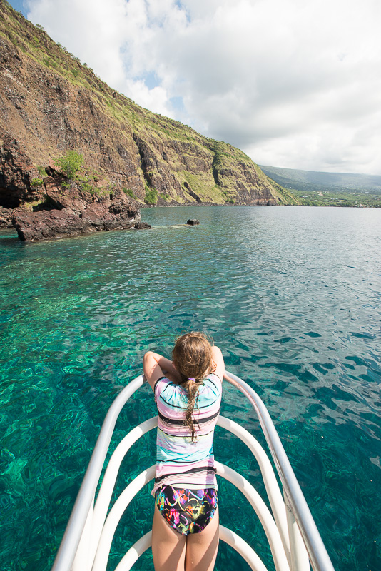 girl on bow of boat in hawaii