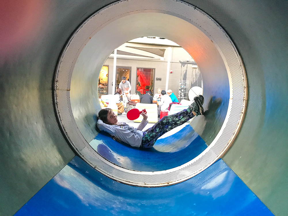 kate playing tube ping pong at hotel zephyr in san francisco