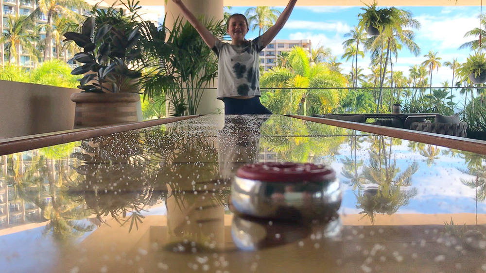 kate scoring at shuffle board in maui hawaii
