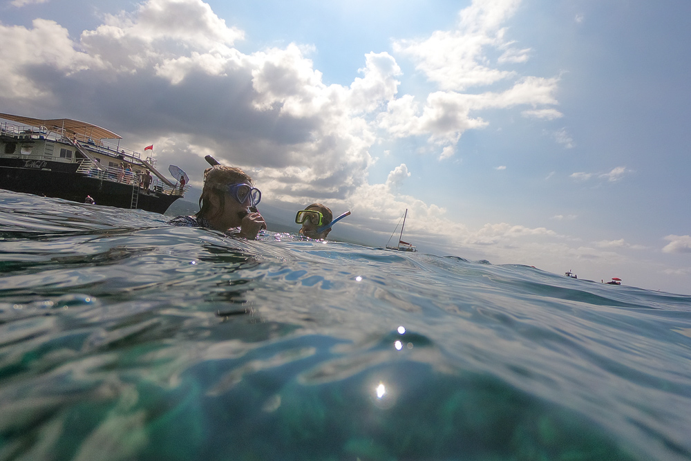 mother and daughter at water surface in hawaii