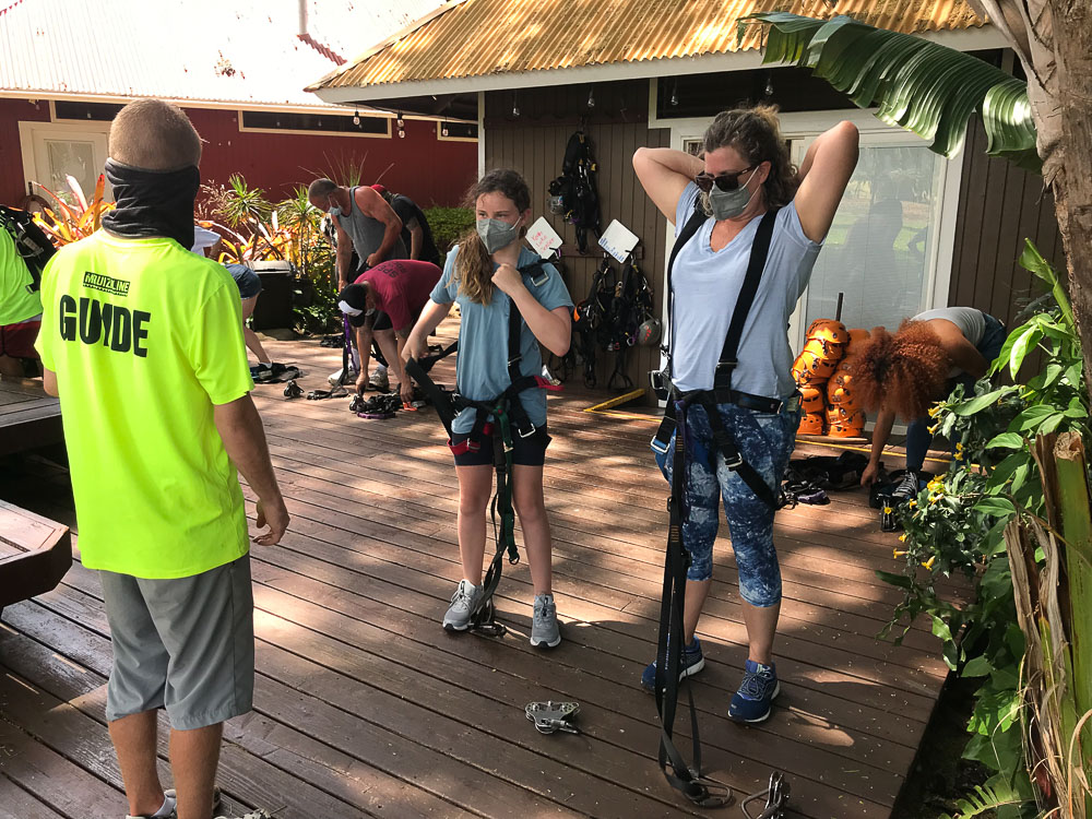 people getting zip line instructions