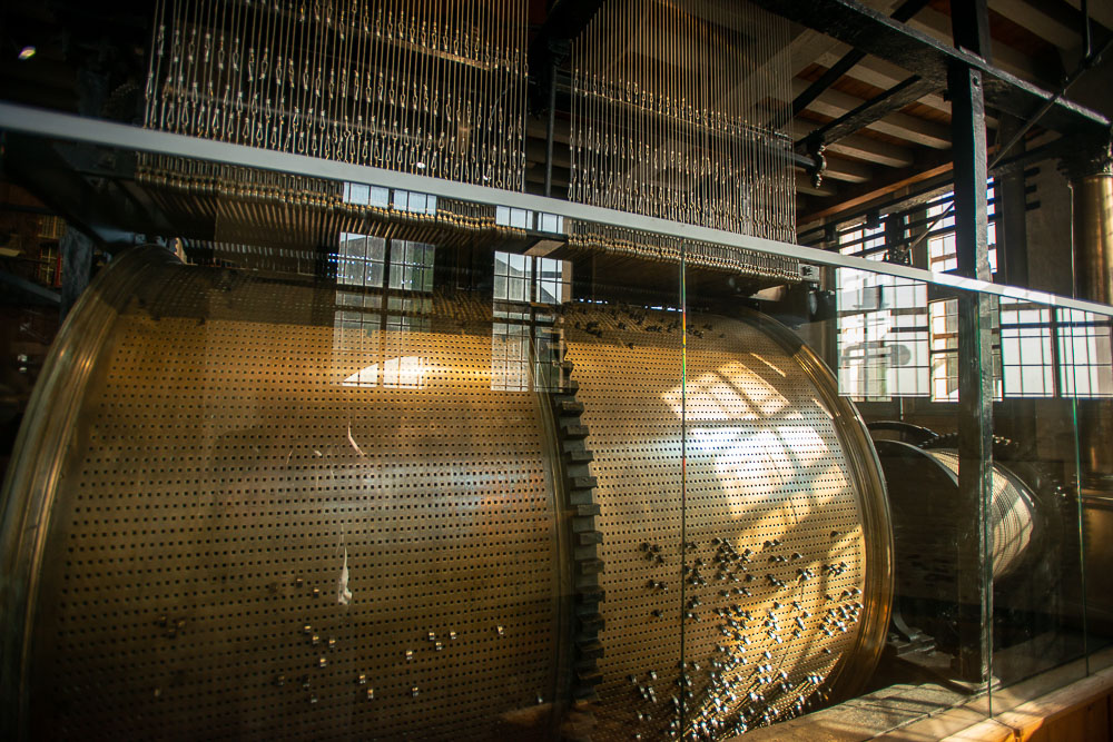 playing drum cylinder in the belfry tower in bruges Belgium