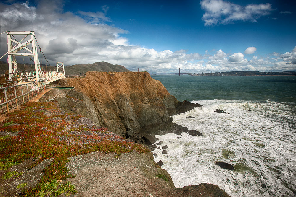 suspension bridge to point bonita lighthouse and golden gate bridge in background