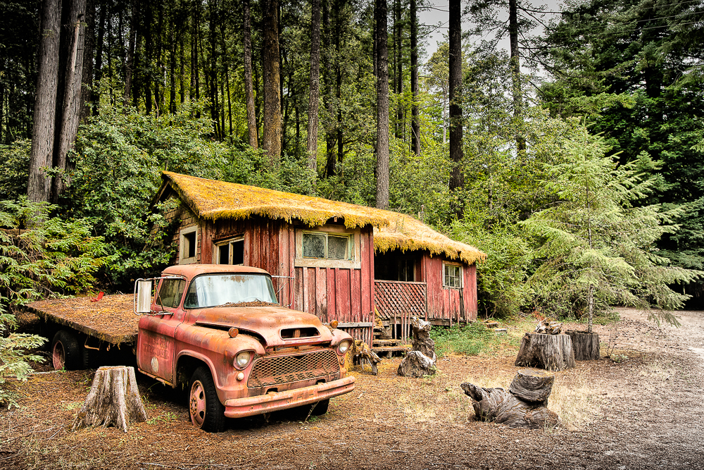 truck next to abandoned house in hales grove